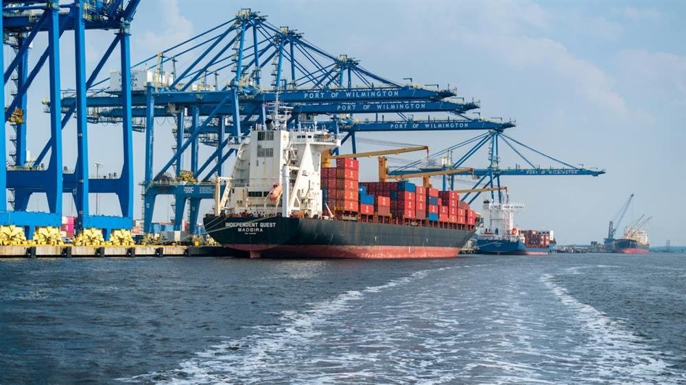 Port cranes working a container ship